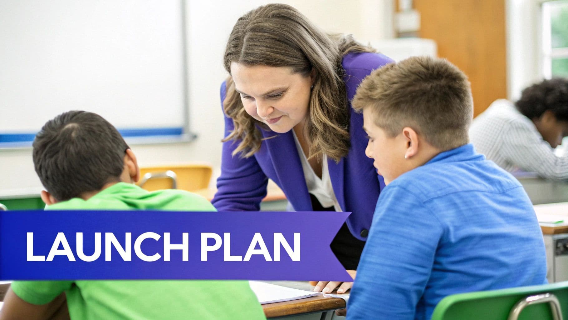 A female teacher in a purple blazer assists two young male students at their desks in a classroom.